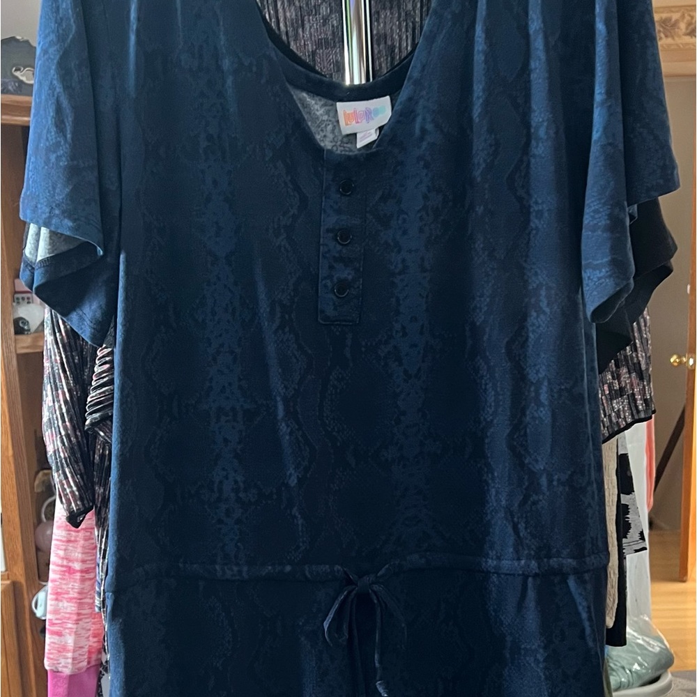 Brand new with tags, LuLaRoe Xanthe romper.  Blue snakeprint, size M